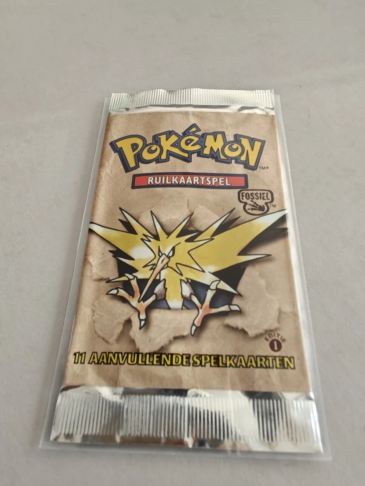 Fossil Primera edición Sobre de refuerzo — Zapdos